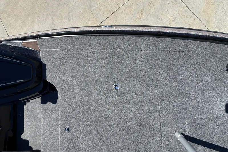 Slide: The Image of 2027 Nitro Z20 XL Pro boat deck with gray carpeting and metal fixtures. - 29