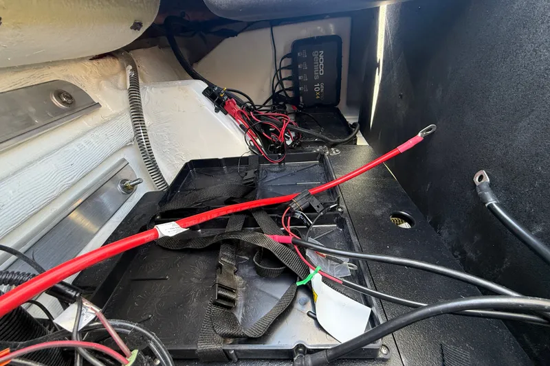 Slide: The Image of Interior view of a 2027 Nitro Z20 XL Pro boat showing wiring and battery compartment. - 44