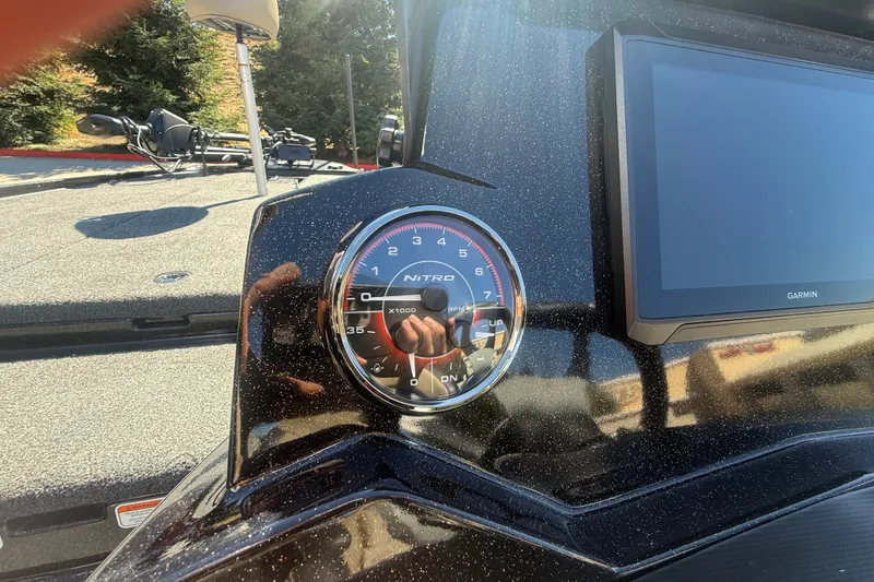 Slide: The Image of Dashboard of 2027 Nitro Z20 XL Pro boat with tachometer and Garmin display. - 25