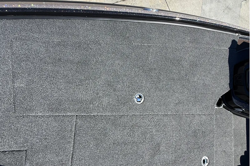 Slide: The Image of Carpeted deck of a 2027 Nitro Z20 XL Pro boat with metal fixtures. - 28