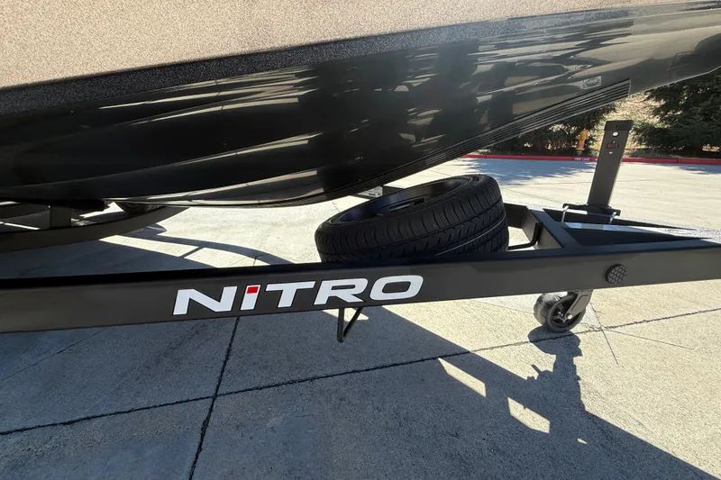 Slide: The Image of 2027 Nitro Z20 XL Pro boat trailer with spare tire on concrete surface. - 46
