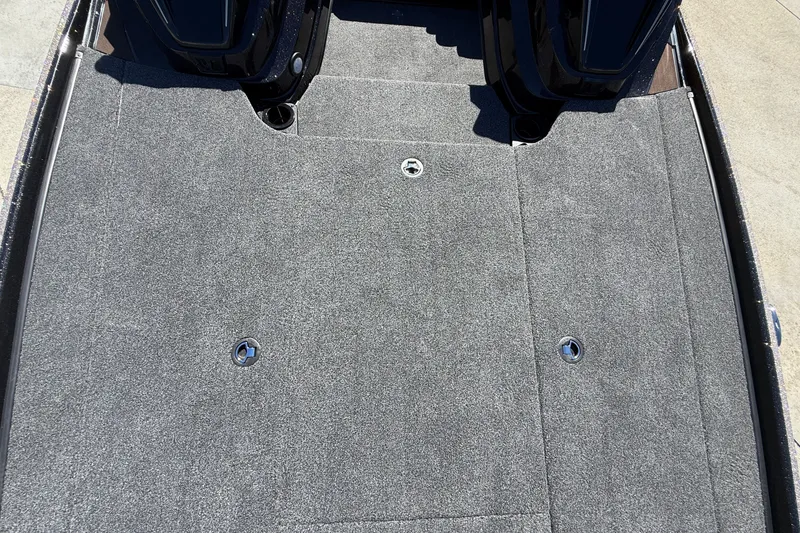 Slide: The Image of Carpeted deck of a 2027 Nitro Z20 XL Pro boat, featuring storage compartments. - 27