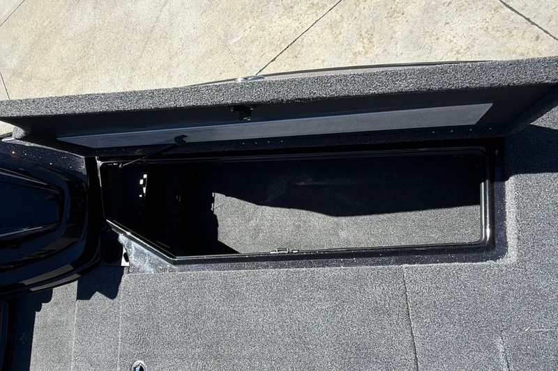 Slide: The Image of Open storage compartment on 2027 Nitro Z20 XL Pro boat deck. - 32