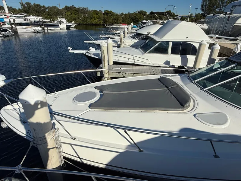 Slide: The Image of 2005 Cruisers Yachts 340 Express docked at a marina. - 17