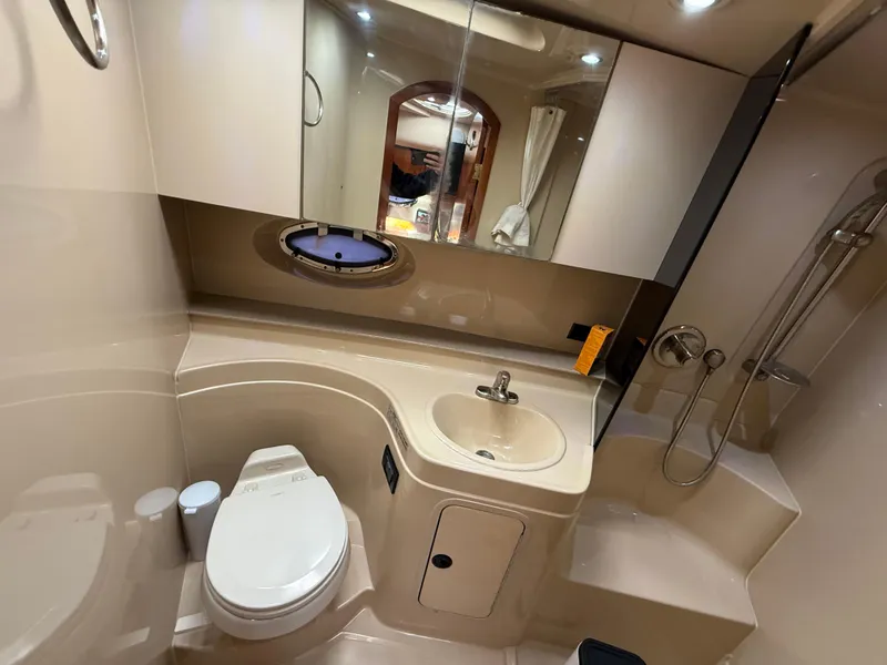 Slide: The Image of 2005 Cruisers Yachts 340 Express bathroom with sink, toilet, and shower. - 27