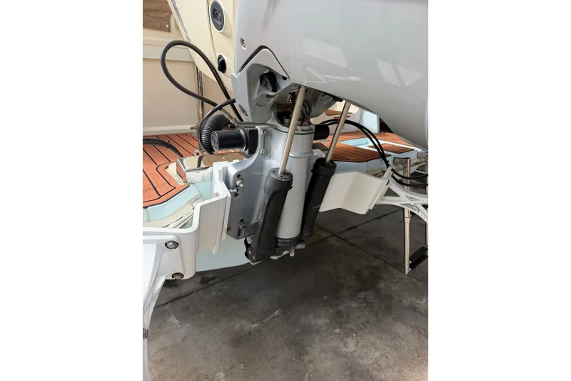 Slide: The Image of 2024 Scout 240 XSF boat engine detail with hydraulic components and sleek design. - 45