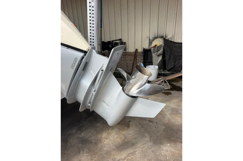 Slide: The Image of 2024 Scout 240 XSF boat propeller in a garage setting. - 43