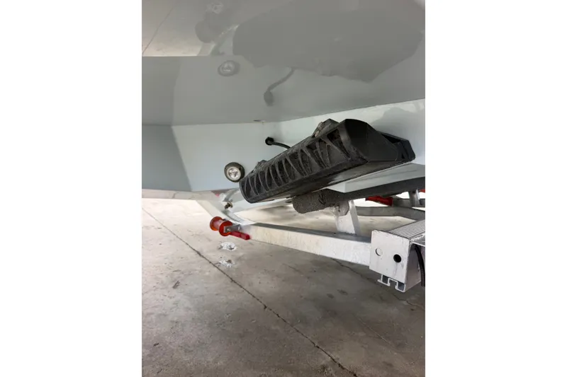 Slide: The Image of 2024 Scout 240 XSF boat trailer detail, featuring support and attachment components. - 46