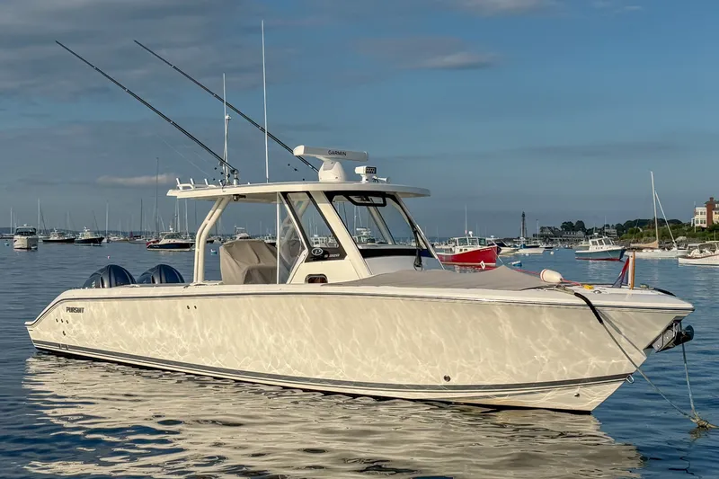 The Image of 2020 Pursuit S 328 Sport boat on calm water with fishing rods. - 0