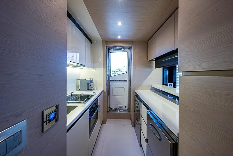 Slide: The Image of Modern kitchen interior on 2017 Azimut 80 yacht, featuring sleek cabinetry and appliances. - 53