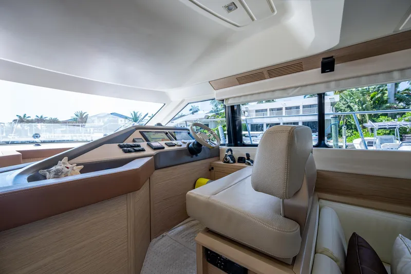 Slide: The Image of 2015 Beneteau Monte Carlo yacht interior with modern helm and panoramic windows. - 47