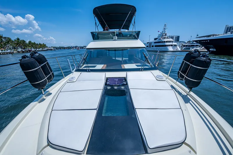 Slide: The Image of 2015 Beneteau Monte Carlo yacht on water, showcasing sleek design and luxurious deck. - 13