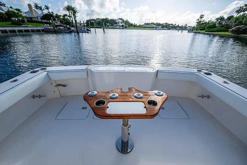 Slide: The Image of Cockpit view of 2008 Bertram 360 yacht with scenic waterfront backdrop. - 28