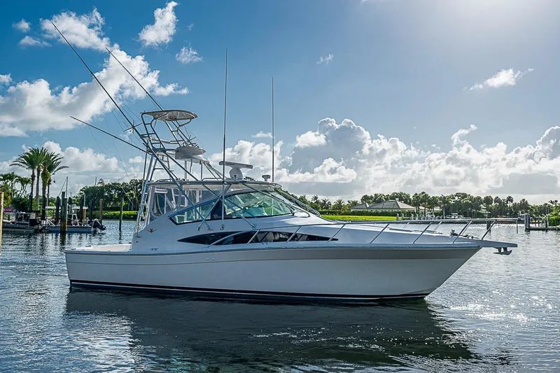 Slide: The Image of 2008 Bertram 360 yacht on calm water under a bright blue sky. - 51
