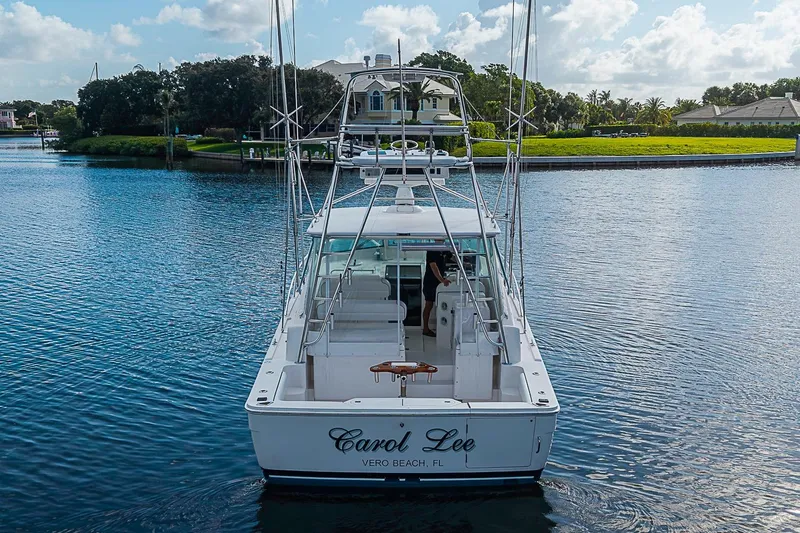 Slide: The Image of 2008 Bertram 360 boat on calm water near Vero Beach, Florida, under a partly cloudy sky. - 7