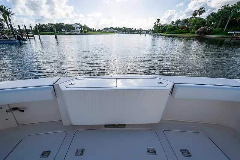 Slide: The Image of Bertram 360 boat deck overlooking serene waterfront, 2008 model. - 32