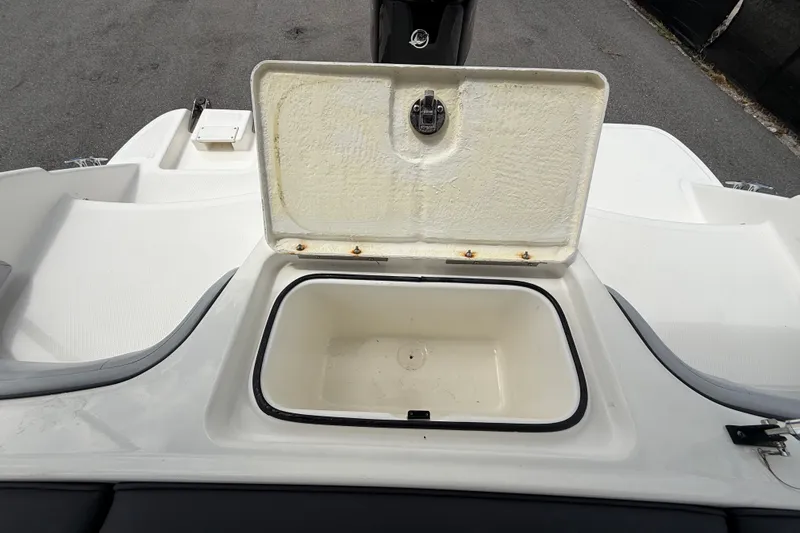 Slide: The Image of Open storage compartment on 2024 Bayliner Element M17 boat deck. - 46