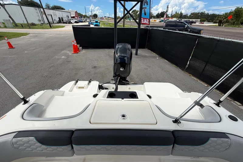 Slide: The Image of 2024 Bayliner Element M17 boat rear view with outboard motor in parking area. - 45