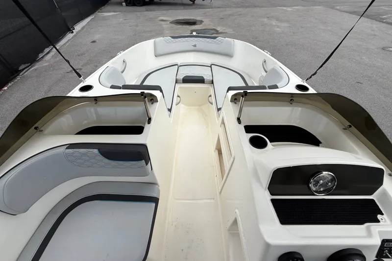Slide: The Image of 2024 Bayliner Element M17 boat interior with seating and storage compartments. - 24