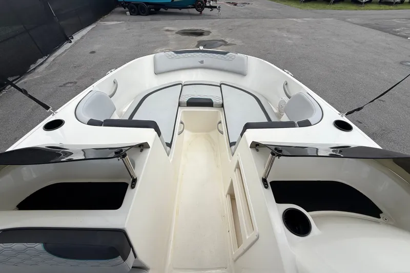 Slide: The Image of 2024 Bayliner Element M17 boat interior with seating and storage compartments. - 25