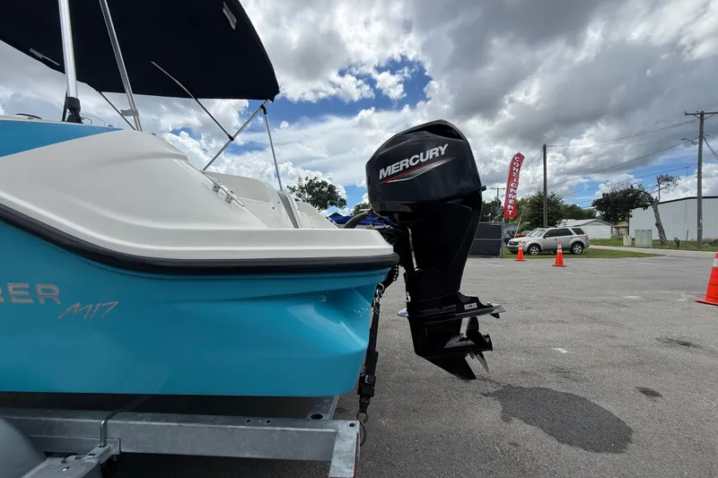 Slide: The Image of 2024 Bayliner Element M17 boat with Mercury outboard motor on a trailer. - 8