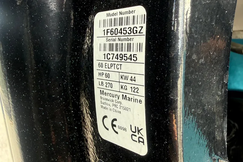 Slide: The Image of A label on a boat engine shows model and serial numbers, along with technical specifications. - 49