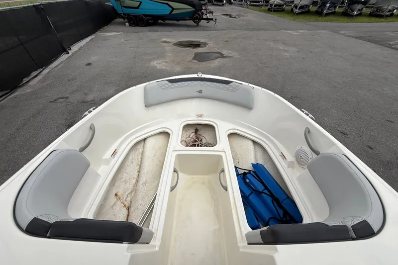 Slide: The Image of 2024 Bayliner Element M17 boat interior with seating and storage compartments. - 29