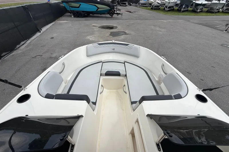 Slide: The Image of 2024 Bayliner Element M17 boat interior with seating and cup holders. - 27