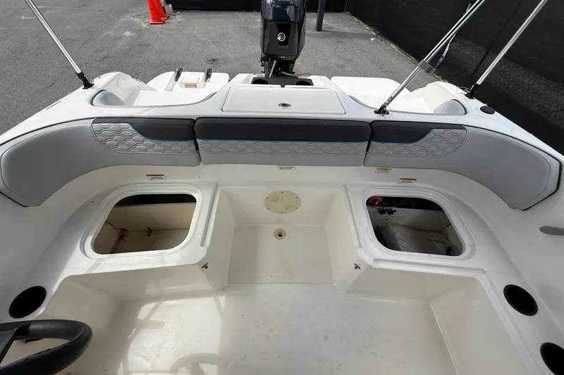 Slide: The Image of 2024 Bayliner Element M17 boat interior with storage compartments and seating. - 41