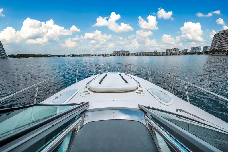 Slide: The Image of 2014 Monterey 320 Sport Yacht on calm water with city skyline. - 26