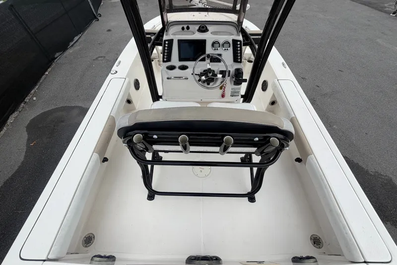 Slide: The Image of 2019 Robalo 226 Cayman boat interior with steering console and seating. - 15