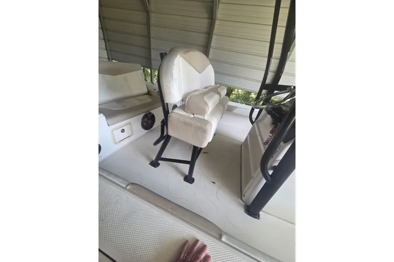 Slide: The Image of 2019 Robalo 226 Cayman boat interior with seating and steering console. - 13