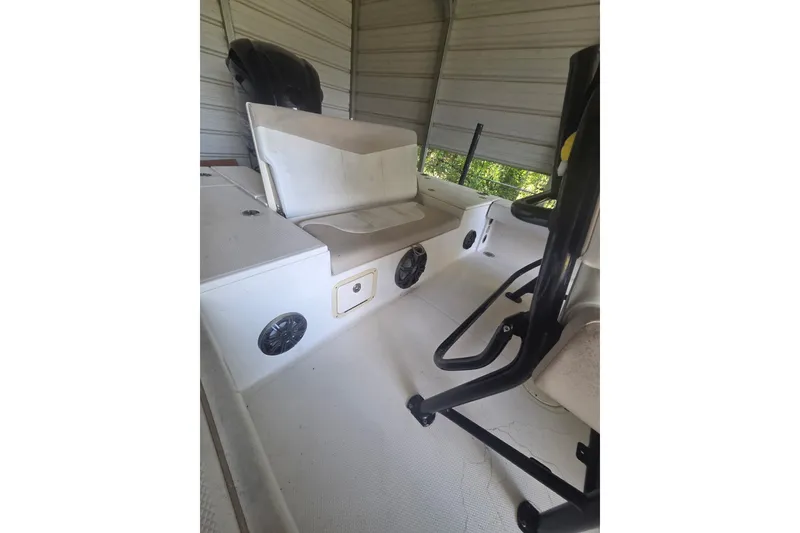 Slide: The Image of 2019 Robalo 226 Cayman boat interior with seating and storage compartments. - 8