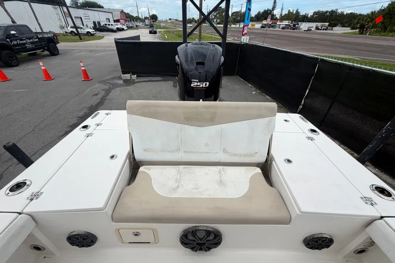Slide: The Image of 2019 Robalo 226 Cayman boat with Yamaha 250 engine, parked near road. - 62