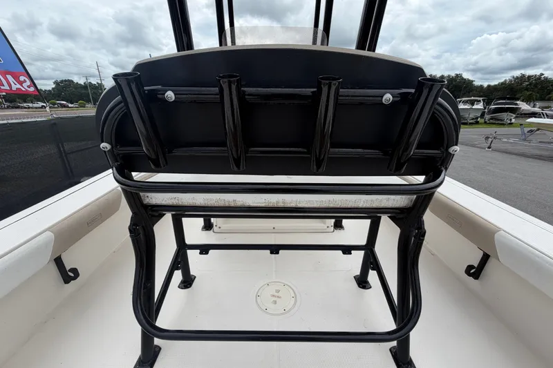 Slide: The Image of 2019 Robalo 226 Cayman boat interior with rod holders and seating. - 16