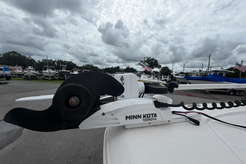 Slide: The Image of Minn Kota Terrova trolling motor on 2019 Robalo 226 Cayman boat, cloudy sky background. - 48