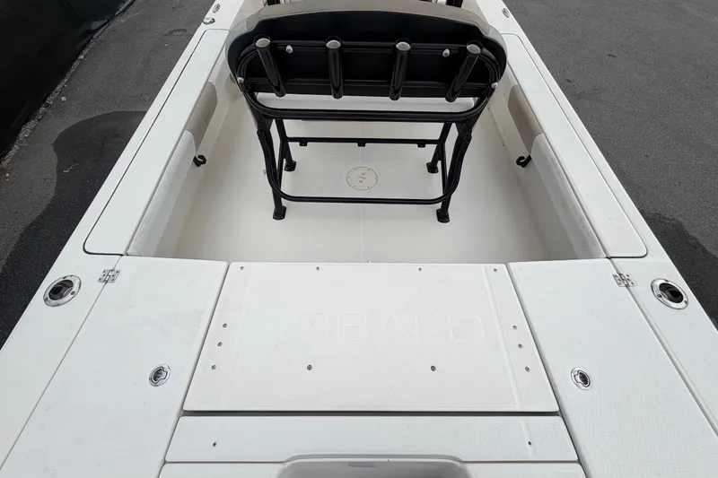 Slide: The Image of The image shows the cockpit of a 2019 Robalo 226 Cayman with a bench seat and storage. - 14