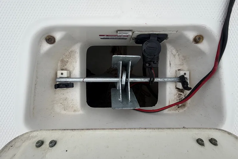 Slide: The Image of An anchor compartment with an anchor and cables inside a boat. - 46