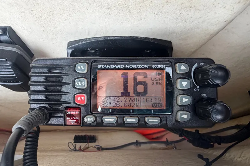 Slide: The Image of VHF marine radio on 2019 Robalo 226 Cayman boat, displaying channel 16. - 30