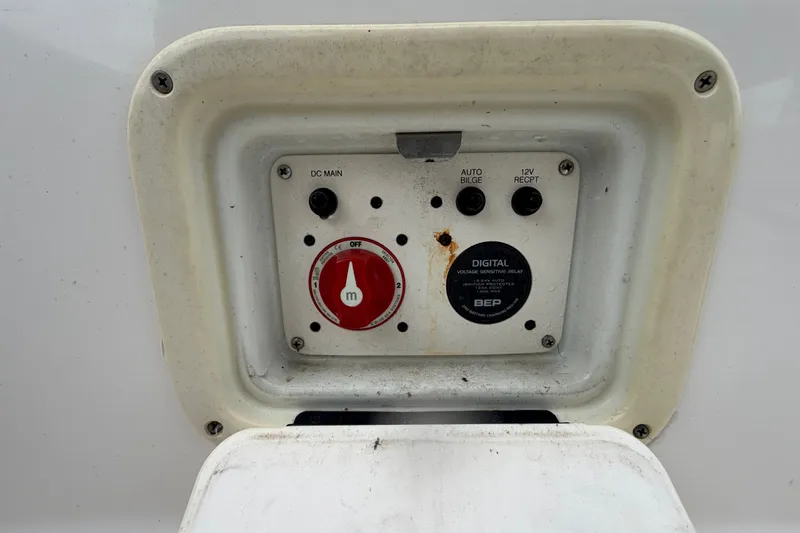 Slide: The Image of Control panel of a 2019 Robalo 226 Cayman boat with switches and dials. - 66