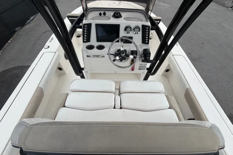 Slide: The Image of 2019 Robalo 226 Cayman boat cockpit with steering wheel and control panel. - 17