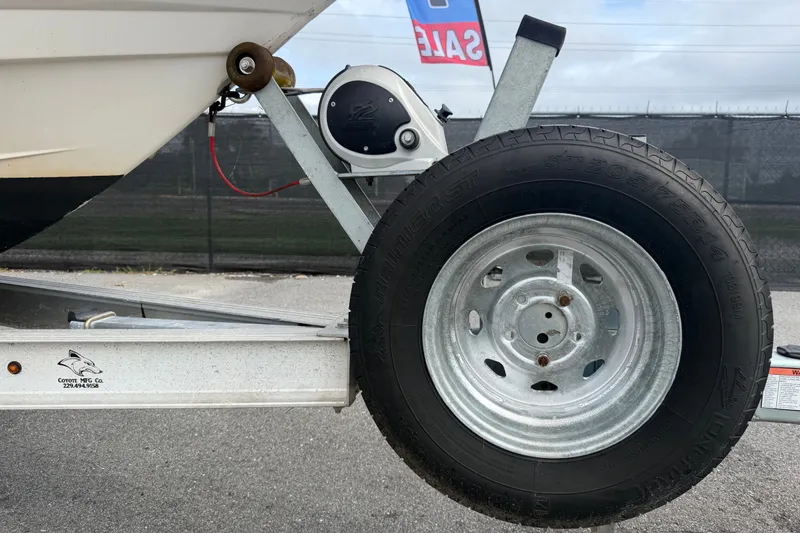 Slide: The Image of Trailer wheel and hitch of a 2019 Robalo 226 Cayman boat for sale. - 85