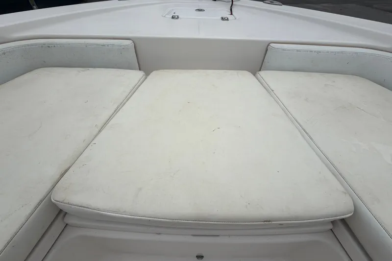 Slide: The Image of 2019 Robalo 226 Cayman boat interior with cushioned seating area. - 39
