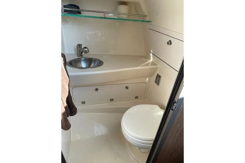 Slide: The Image of 2012 Boston Whaler 285 Conquest boat bathroom with sink and toilet. - 16