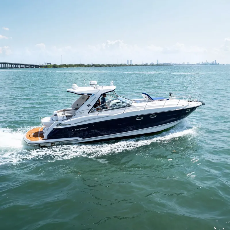 The Image of 2008 Monterey 400 Sport Yacht cruising on open water. - 0