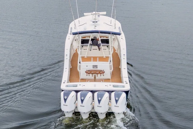 Slide: The Image of 2018 Regulator 41 boat with four engines cruising on water. - 5