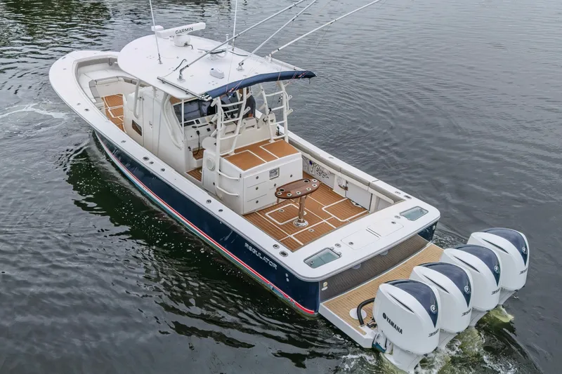 Slide: The Image of 2018 Regulator 41 boat with four Yamaha engines on calm water. - 6