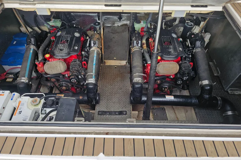 Slide: The Image of Engine compartment of a 2007 Regal Commodore 4460 boat, featuring dual inboard motors. - 16