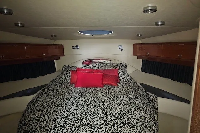 Slide: The Image of Luxurious cabin interior of 2007 Regal Commodore 4460 yacht with elegant bedding. - 15