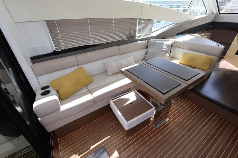 Slide: The Image of Luxurious interior of 2019 Beneteau Gran Turismo 50 yacht with plush seating and modern table. - 17